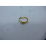 18ct yellow gold solitaire diamond ring, approx 0.10 carat, marked 750, size K, approx 2.4g