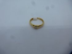 18ct yellow gold solitaire diamond ring, approx 0.10 carat, marked 750, size K, approx 2.4g