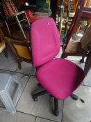 Pink office chair on wheels