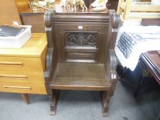 An old Oak Church chair, having carved back