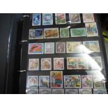 Four albums of World stamps