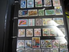 Four albums of World stamps