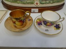 A Royal Worcester coffee cup and saucer decorated fruit signed Roberts and one other example