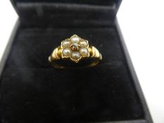 Pretty 18ct yellow gold ring with seed pearls, forming a flower with central diamond chip, marked 18