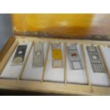 A quantity of early 20th century medical glass microscopic slides and a portable microscope