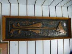 A mid century copper plaque of an elongated cat