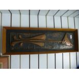 A mid century copper plaque of an elongated cat