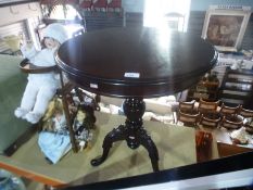 Mahogany circular coffee table on splayed supports