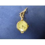 A vintage ladies 9ct gold ROLEX (stamped RWC) watch bracelet also gold.  Winds and ticks. Complete i