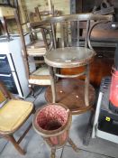 Round coffee table, wooden round chair and a sewing basket on tall supports