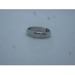 Platinum band ring with channel set brilliant cut diamonds, approx 6.5g, marked 950
