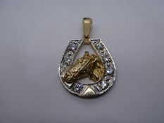 9ct yellow gold horse shoe design pendant inset with 7 zircons, with yellow gold horse head, marked