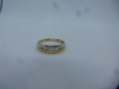 Pretty two tone 18ct gold split ring, inset with 7 graduated diamonds, size L/M, marked 750, 2.8g ap