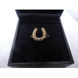 9ct yellow gold dress ring designed as a horseshoe set with seed pearls, marked 9ct, size P, weight