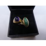 Two 9ct yellow gold dress rings, one set with green hardstone, the other a purple cabochon stone, b