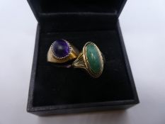 Two 9ct yellow gold dress rings, one set with green hardstone, the other a purple cabochon stone, b