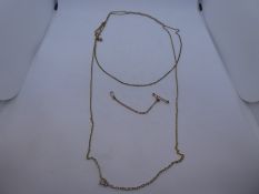 9ct yellow gold neckchain, marked 375, marked 9ct and another yellow metal example, lot weight