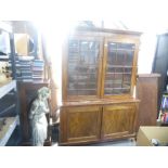 A Victorian mahogany bookcase having cupboard base, 141cm