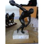 A bronze style figure of discus thrower on white marble base