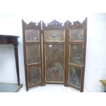 An Arts and Crafts style folding fire screen having eight copper panels decorated with birds and dee