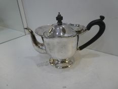 A silver tea pot on pedestal foot hallmarked Birmingham 1906, with decorative edge, approx 10.75ozt,