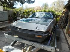 A TRIUMPH TR7 in silver, requiring restoration, 84,864 showing on mileage, with wire wheels