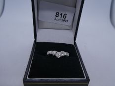 18ct white gold wishbone design graduated diamond 7 stone ring, the central diamond 0.25 carat