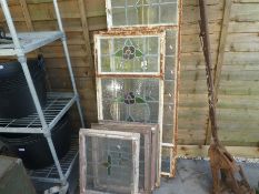 Five old lead painted windows, three square, two larger rectangular with openings