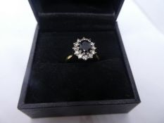 18ct yellow gold ring, with central sapphire surrounded by diamonds, marks worn, size N, approx 3.9g