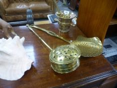 An antique brass pestle and mortar a brass skimmer and a chestnut roaster