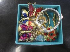 A small collection of costume jewellery to include a ladies watch, pretty enamelled watches, bangle,