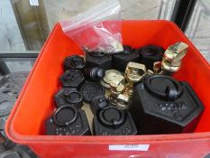 A box of brass and black weights