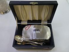 A silver lot comprising of a cased sterling silver topped dressing table brush and comb hallmarked B