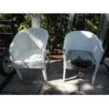 Two white wicker chairs