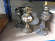 Three brass oil lamps