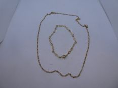 9ct yellow neckchain, marked 375 and a similar 9ct yellow gold bracelet, both marked 375, weight app