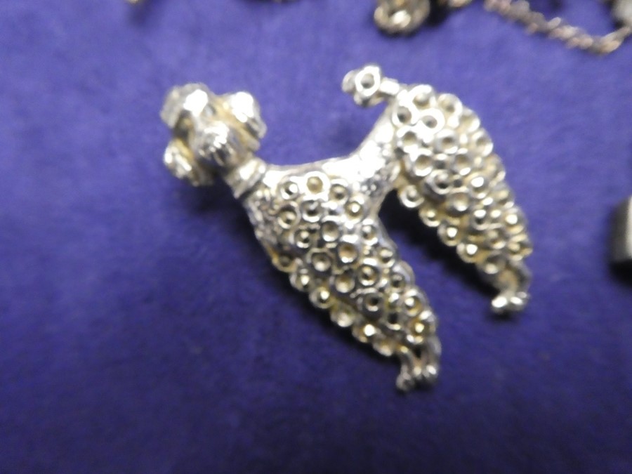 Collection of mainly silver costume jewellery to include, neck chains, charms, greyhound brooch, art - Image 5 of 6