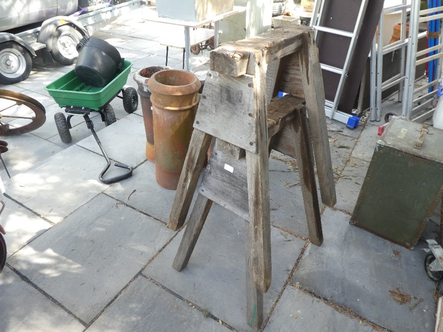 Two wooden saw trestles