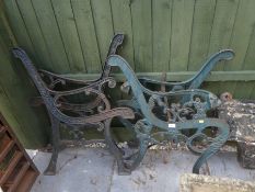 Two pairs of cast iron bench ends