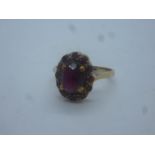 9ct yellow gold garnet set cluster ring, marked 375, size N, 2.8g approx