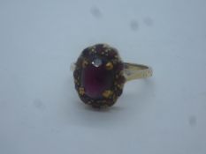 9ct yellow gold garnet set cluster ring, marked 375, size N, 2.8g approx