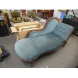 A late Victorian chaise longue having carved decoration