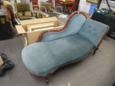 A late Victorian chaise longue having carved decoration