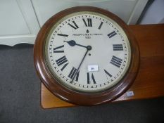An old mahogany fusee wall clock, the dial marked Prescot Clock Co, 1939, with military arrow, dial