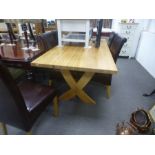 A modern oak oblong dining table having X frame supports and a set of six dining chairs, table 180cm