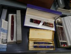 A Waterman Laureat MKII Minera fountain pen and Rollerball set with red marble decoration and other