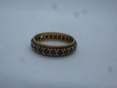 9ct white gold diamond set band ring and a 9ct yellow gold garnet set eternity ring, size Q, approx