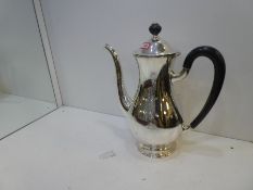 A large heavy silver teapot, Swiss silver hallmarked Jezler 800, with a pedestal foot and with mater