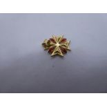 18ct yellow gold starburst pendant with 4 oval orange stones, marked 750