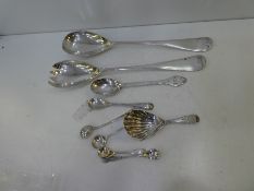 A mixed lot of silver cutlery to include a Georgian silver caddy spoon, serving spoons, etc, 7.21 oz